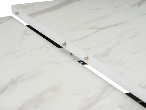Caldo Extendable dining table close-up of the marble-look laminate top extension mechanism.