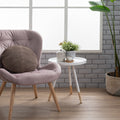 Camilla White Tripod Side Table with bentwood top and solid wood legs in modern room with chair and plants