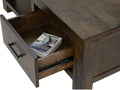 Open drawer of Caro Rustic Coffee Table - Dark Solid Wood showcasing its storage space and craftsmanship.