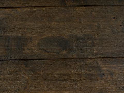 Close-up view of dark solid wood texture from the Caro Rustic Coffee Table - Dark Solid Wood showcasing rich grain patterns.