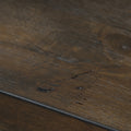 Close-up of Caro Rustic Coffee Table - Dark Solid Wood showcasing natural grain patterns and textures.