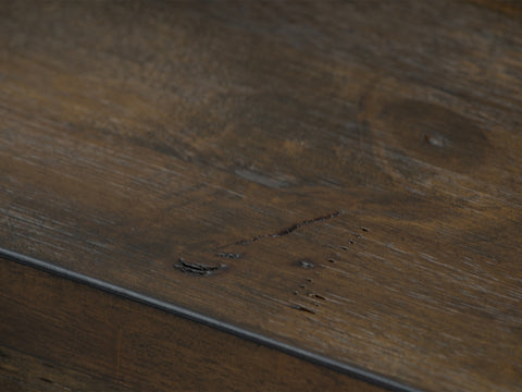 Close-up of Caro Rustic Coffee Table - Dark Solid Wood showcasing natural grain patterns and textures.