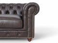 Close-up of Stanhope Dark Chocolate 3 Seater Chesterfield arm in rich aniline leather with tufted detailing and nailhead trim.