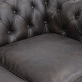 Close-up of Stanhope Dark Chocolate 3 Seater Chesterfield leather upholstery showcasing rich texture and button-tufting.