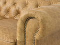 Close-up of a Stanhope Camel Brown Distressed Leather 4 Seater Chesterfield arm detail