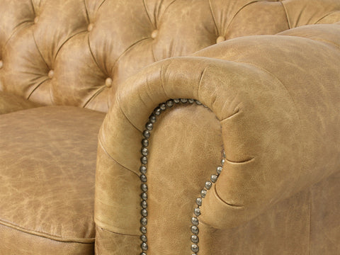 Close-up of a Stanhope Camel Brown Distressed Leather 4 Seater Chesterfield arm detail