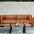 Eleganza Cognac Distressed Leather 3 Seater Sofa with plush cushions and walnut legs in a modern living room setting.
