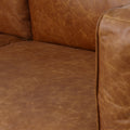 Close-up of Eleganza Cognac Distressed Leather 3 Seater Sofa with plush loose cushions and full top aniline leather texture.