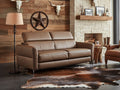 Elena brown Leather Loveseat Sofa Bed in a modern living room with rustic decor and a cowhide rug.