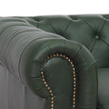 Close-up of Stanhope Royal Green Leather 4 Seater Chesterfield showing tufted arm detail and aniline leather texture.