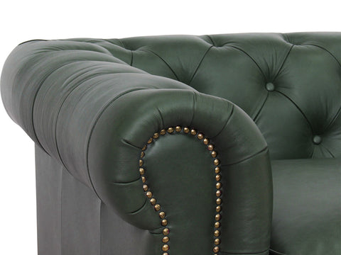 Close-up of Stanhope Royal Green Leather 4 Seater Chesterfield showing tufted arm detail and aniline leather texture.