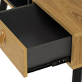Lia Mid-Century Modern Oak Coffee Table with Drawer open showing leather loop handle and black Oakaia Wood legs.