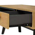 Lia Mid-Century Modern Oak Coffee Table with Drawer featuring oak top and black legs with open drawer and leather loop handle.