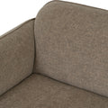 Close-up view of Livia Beige Firm Accent Chair showing Linsey fabric upholstery and curved design.