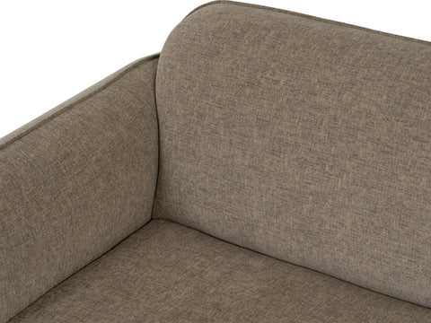 Close-up view of Livia Beige Firm Accent Chair showing Linsey fabric upholstery and curved design.