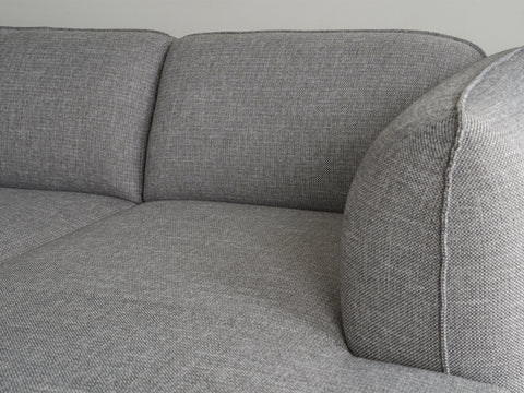 Close-up of Livia Grey Scandi Modern Sectional showing charcoal upholstery and sleek design.