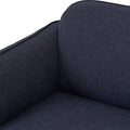 Close-up of Livia Navy Blue Firm Accent Chair with deep toned Linsey fabric upholstery and soft lines.