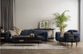 Livia Navy Blue Firm Accent Chair in stylish living room setting with cozy sofa, black metal legs, and modern decor.