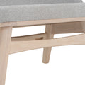 Close-up of Lucca Modern Barrel Armless Chair showing grey cushioned seat and solid wood frame.