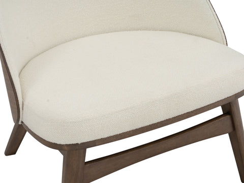 Lucca Modern Barrel Armless Chair with creamy textured upholstery and warm wood frame detail.