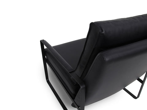 Luna Modern Leather Black Accent Chair with sleek design and premium semi-aniline leather upholstery close up.