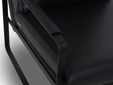 Luna Modern Leather Black Accent Chair with sleek design and premium semi-aniline leather upholstery close up.