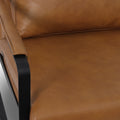 Luna Modern Leather Tan Accent Chair detail showing sleek tan leather upholstery and minimalist black frame.