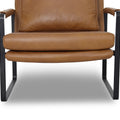Luna Modern Leather Tan Accent Chair detail shot showing sleek tan leather upholstery and minimalist black frame.