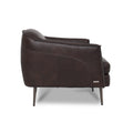 Lusso Vintage brown leather lounge chair showcasing sleek silhouette and slender metal legs from the side.