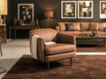 Lusso vintage Chestnut Brown leather accent chair in modern living room setting with complementary decor.