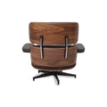 Back view of Meseo Dark Chocolate Leather Lounge Chair and Ottoman with walnut-colored eucalyptus veneer and swivel base.