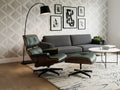 Meseo Royal Green Leather Lounge Chair and Ottoman in a stylish living room setting with modern decor.