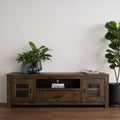 Mira Rustic TV Stand in dark wood with plants, showcasing a timeless, rustic design in a modern living space.