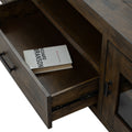 Open drawer of Mira Rustic TV Stand showing interior wood finish and a book, highlighting the dark wood craftsmanship.