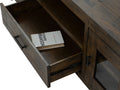 Open drawer of Mira Rustic TV Stand showing interior wood finish and a book, highlighting the dark wood craftsmanship.