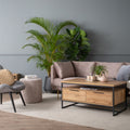 Modern living room featuring Moda industrial Style Coffee Table with wood-look design and black metal frame, open shelf, and drawers.