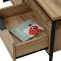 Moda industrial Style Coffee Table with open drawer showing book. Wood-look and black metal design enhances rustic and modern decor.