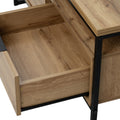 Open drawer of Moda industrial Style Coffee Table showing wood-look finish and black metal frame.