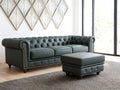 Stanhope Royal Green Leather Chesterfield Ottoman in a living room setting, showcasing luxurious aniline leather and British design.