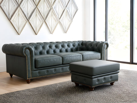 Stanhope Royal Green Leather Chesterfield Ottoman in a living room setting, showcasing luxurious aniline leather and British design.