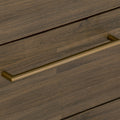 Close-up of brass handle on Nero Mid-Century Fluted Door Sideboard