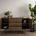 Nero Mid-Century Fluted Door Sideboard with Brass Handles featuring open doors and drawers, styled with plants and books.