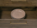 Open drawer of Nero Mid-Century Fluted Door Sideboard with Brass Handles displaying stylish dishes inside.