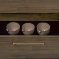 Nero Mid-Century Fluted Door Sideboard with Brass Handles drawer interior displaying three textured silver bowls.