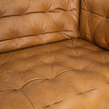 Close-up of the Nova Modern Chesterfield Tan Leather 3 Seater sofa, featuring rich tan leather and tufted detail.