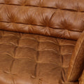 Close-up of the Nova Russet Brown 3 Seater Distressed Leather Sofa featuring deep button tufting and rich leather texture.