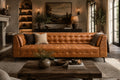 Cozy living room with a brown leather sofa, wooden coffee table, and decorative elements.