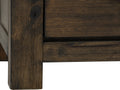 Close-up of dark solid wood detail on Pia Rustic Bookcase showcasing the rich natural grain and texture.