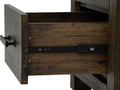 Drawer detail of Pia Rustic Bookcase - Dark Solid Wood, showcasing warm tones and natural wood grain.