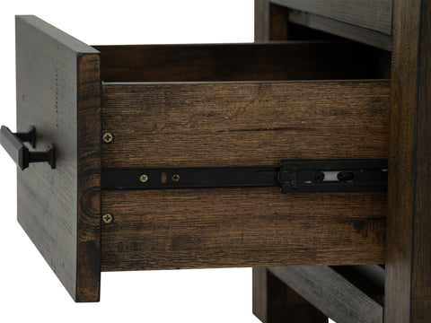 Drawer detail of Pia Rustic Bookcase - Dark Solid Wood, showcasing warm tones and natural wood grain.